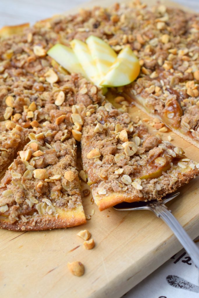 Salted Caramel Apple Pizza is a delicious way to enjoy an apple dessert. Easy to make, this family favorite is great for autumn parties and holidays.