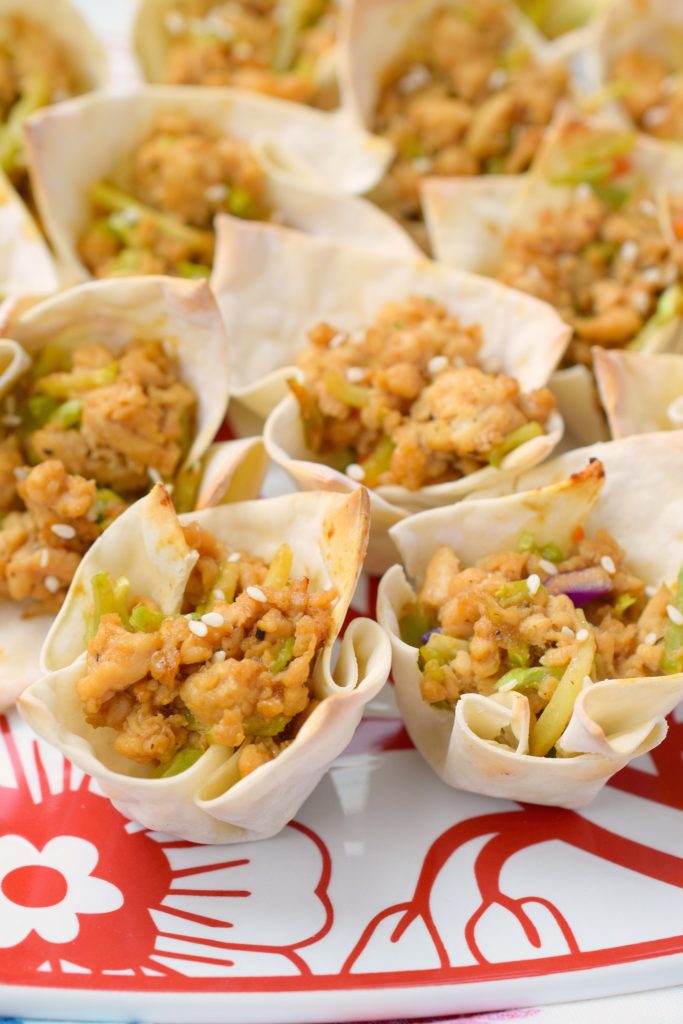 Asian Chicken Wonton Cups are a delicious way to enjoy a bite-sized bit of your favorite flavors. Great for parties or game day, you'll simply love them!