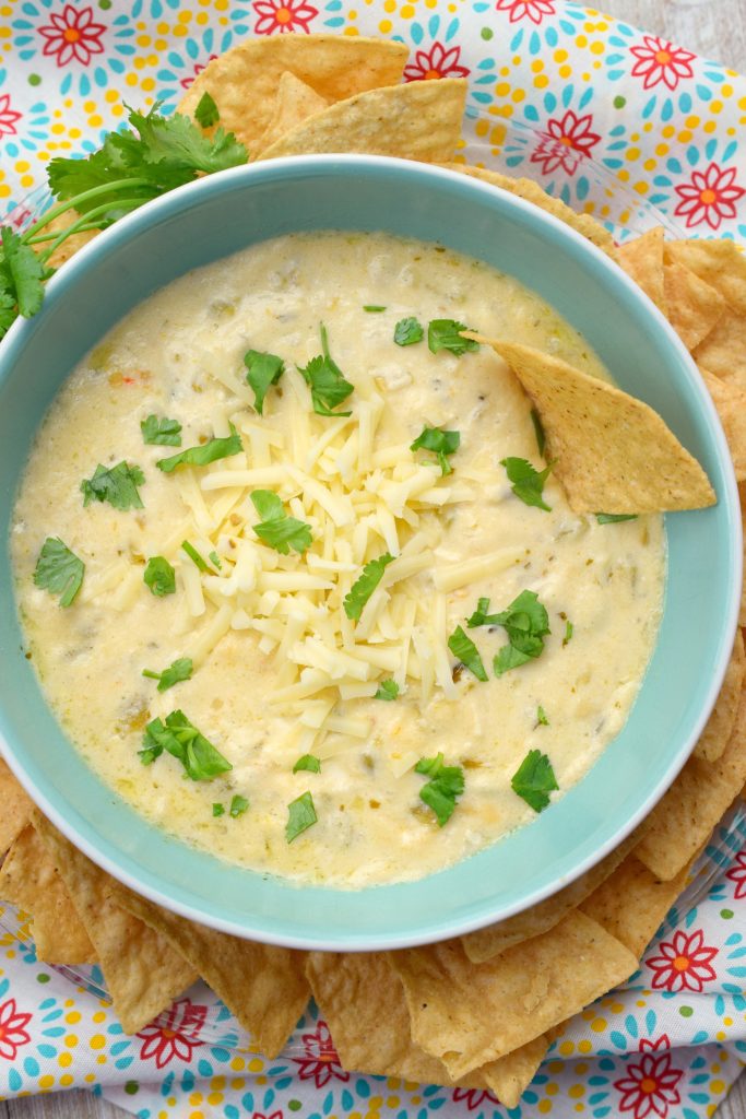 Slow Cooker Four Cheese Queso Dip is always a hit for parties, tailgating, or holiday events. Easy to make, you'll love this appetizer from your crockpot.