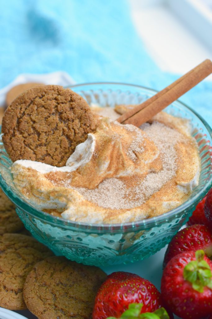 cookie in a bowl of creamy churro dip 